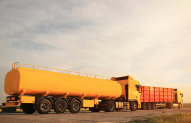 Modern bright trucks parked on country road