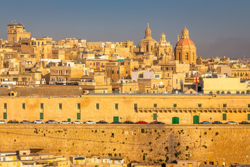 Wall Mural - Valletta from the Ship. Exposure of Valletta, Malta, taken at Sunrise from a ship while arriving at this beautiful fortified city.