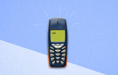 feature phone on paper background