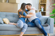 © Krakenimages.com - Beautiful couple hugging in love at the sofa, very happy smiling excited for new home