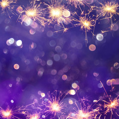 Wall Mural - festive purple background with sparkles light
