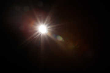 Aufkleber - Lens Flare. Light over black background. Easy to add overlay or screen filter over photos. Abstract sun burst with digital lens flare background. Gleams rounded and hexagonal shapes, rainbow halo.