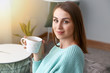 © Pixel-Shot - Beautiful young woman drinking tea at home