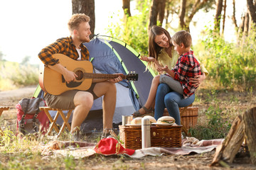 Wall Mural - Happy family spending weekend in forest