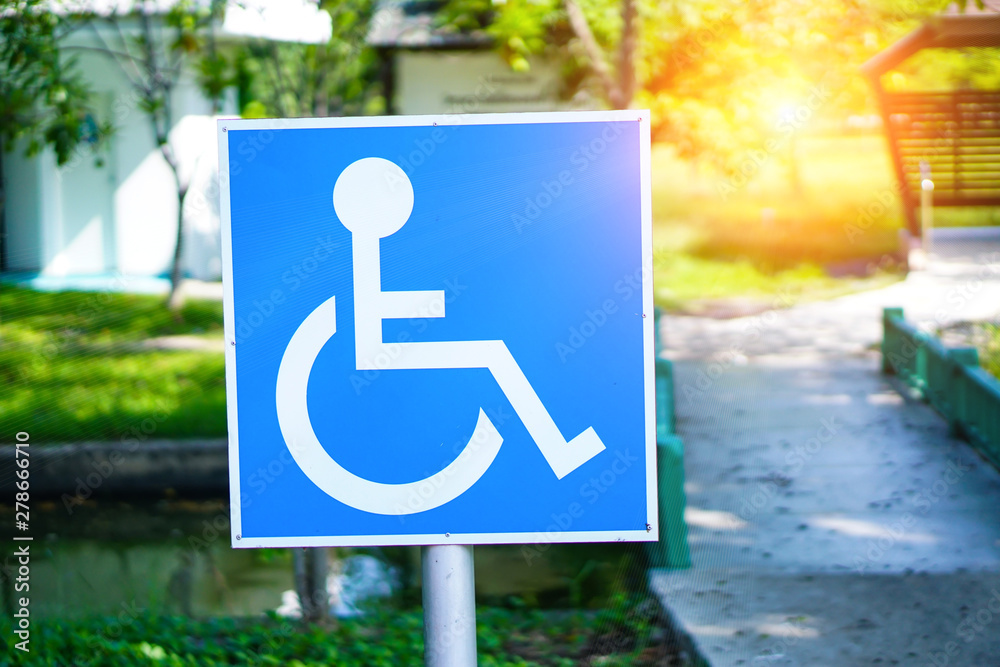 Blue Handicap at parking car sign outdoors for Disabled, Wheelchair or ...