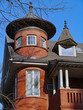 large old brick house with round turret room