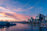 Fototapeta Miasto - Sunset view over Sydney Harbour and business office buildings