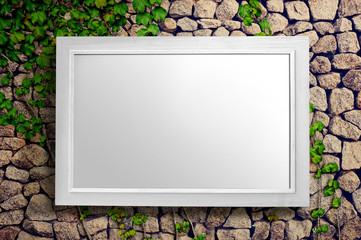 white empty frame picture is on stone wall background