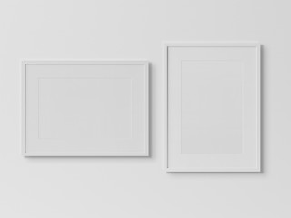 White rectangular frames hanging on a white wall mockup 3D rendering