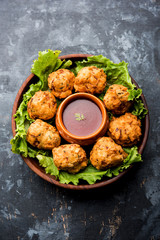 Wall Mural - rava Bhajj or bhajiya also known as suji Pakoda or semolina Pakora, served with tomato ketchup. selective focus