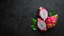 Fresh Pytahya On A Black Background. Dragon Fruit. Tropical Fruits. Top View. Free Space For Text.