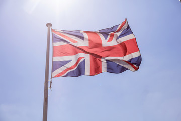 Poster - Great Britain flag waving against clear blue sky