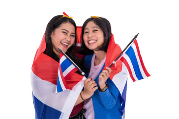 asian woman holding thailand national flag isolated over white background