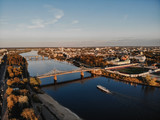 Fototapeta Miasto - The old Volga bridge in Tver over the Volga at sunset. Top view