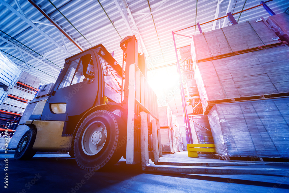 Forklift loader in storage warehouse ship yard. Distribution products. Delivery. Logistics. Transportation. - obrazy, fototapety, plakaty 