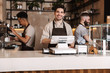 © Drobot Dean - Happy coffee men colleagues in cafe bar working indoors.