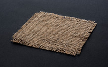 Old Burlap Fabric Napkin On Black Background