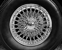 Closeup Of Vintage Car Wire Wheel In Black And White