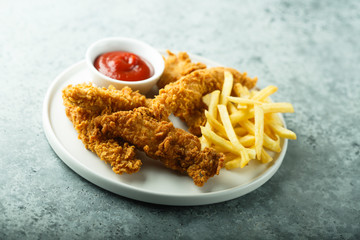 Wall Mural - Homemade fish and chips on white plate