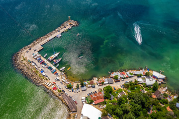 Wall Mural - Aerial top view from drone to the seacoast and the marina with boats and yachts. Sea landscape with yachts from above