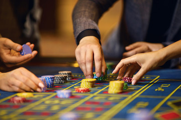 Wall Mural - Chips in the hands of a player in a casino.