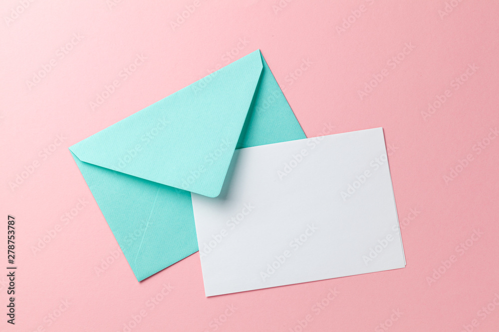 Green envelope and blank letter on pink background. Template with place for text on postcard. mock-up - obrazy, fototapety, plakaty 
