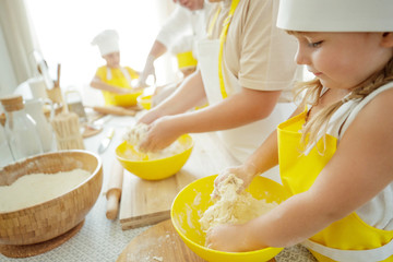 Culinary Master Class. Children in the kitchen are cooking. 