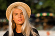 © Artem Markin - Portrait of a beautiful blonde wearing a straw hat. Modern woman. Travel around the world