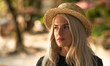 © Artem Markin - Portrait of a beautiful blonde wearing a straw hat. Modern woman. Travel around the world