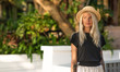 © Artem Markin - Portrait of a beautiful blonde wearing a straw hat. Modern woman. Travel around the world