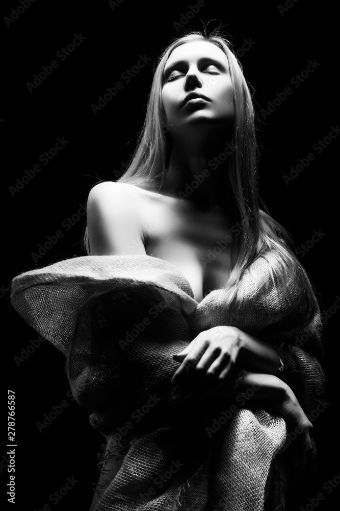 Beautiful young slim busty and leggy naked blonde model girl, sensually