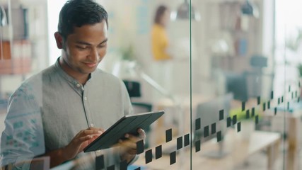 Poster - Portrait of Handsome Professional Indian Man Uses Touch Screen Digital Tablet Computer, Writes Important Email, Smiles Charmingly. Successful Man Working in Bright Diverse Office