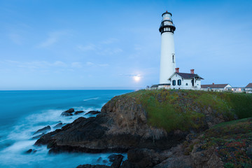 Wall Mural - White pigeon point lighthouse with a blue sky  Historic Old Lighthouse at sunset - Pigeon Point Lighthouse - California, USA