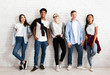 © Prostock-studio - Group of stylish friends students posing over white wall