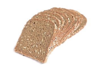 Wall Mural - Loaf of fresh sliced multigrain gluten free bread with sesame, flax seeds, isolated on white.