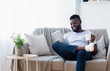 © Prostock-studio - African american man watching movie on tablet