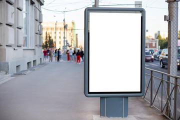 Vertical blank billboard. Mockup of outdoor advertising with copy space on the city street sidewalk