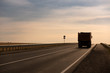 © Chepko Danil - Truck driving on the asphalt road rural landscape