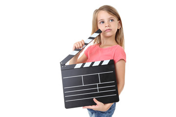 Wall Mural - Little girl with clapper board isolated on white background