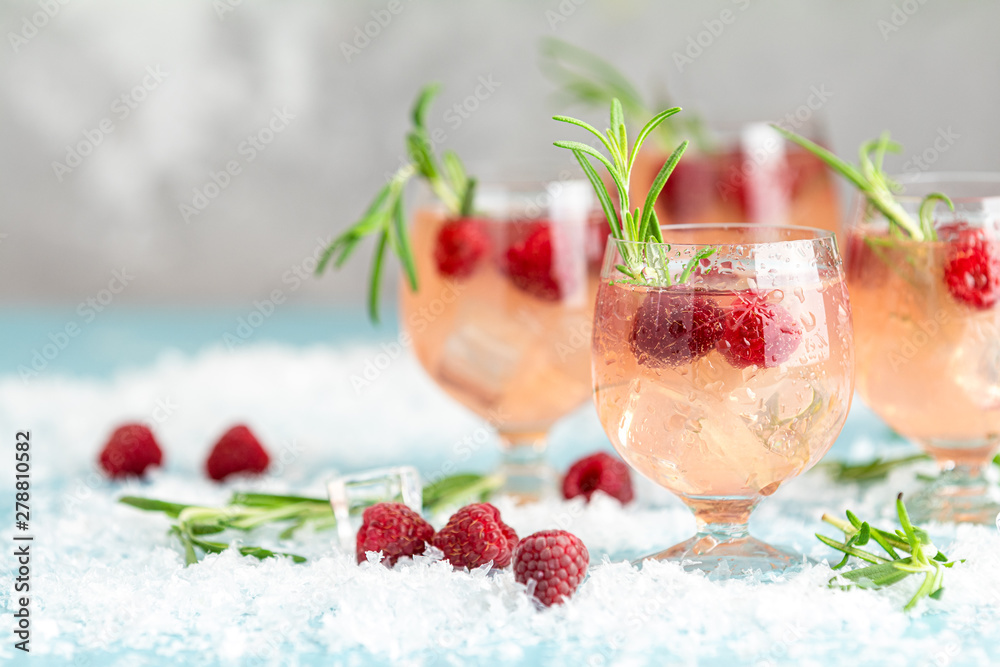 Christmas pink drink raspberry with rosemary and ice Stock Photo ...
