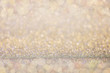 Abstract gold glitter bokeh lights background.