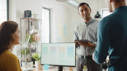 Poster - Three Mobile Software Developers Work on Desktop Computer, They Discuss Smartphone Application Design Use Touch Screen Digital Tablet. Modern Stylish Office with Diverse Team of Professionals Working