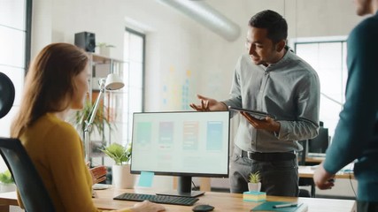 Aufkleber - Three Mobile Software Developers Work on Desktop Computer, They Discuss Smartphone Application Design Use Touch Screen Digital Tablet. Modern Stylish Office with Diverse Team of Professionals Working