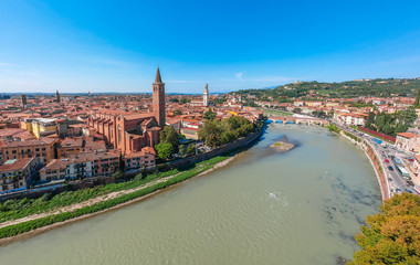 Panoramic cityscape aerial view on Verona historical center, bridge and Adige river. Famous travel destination in Italy. Old town where lived Romeo and Juliet from Shakespeare story