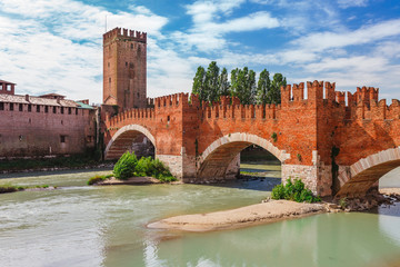 Wall Mural - Panoramic cityscape aerial view on Verona historical center, bridge and Adige river. Famous travel destination in Italy. Old town where lived Romeo and Juliet from Shakespeare story