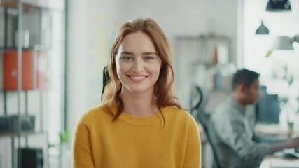 Aufkleber - Portrait of Beautiful Young Woman with Red Hair Wearing Yellow Sweater Smiling at Camera Charmingly. Successful Woman Working in Bright Diverse Office