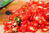Fototapeta Kuchnia - Popular sliced ​​red green chilies are mixed with seasonings for eating with Thai food