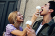 © Ramon Lopez/ADDICTIVE STOCK - Smiling woman feeding ice cream to her boyfriend