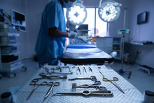 Surgical Instruments Arranged On Table In Operating Room Of Hospital