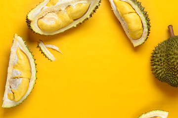 Wall Mural - durian  on bright yellow background with copyspace